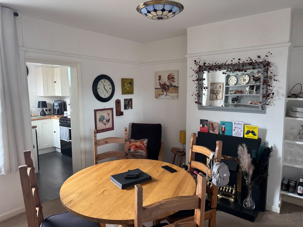 Lot: 158 - TWO-BEDROOM END-TERRACE HOUSE FOR INVESTMENT - Dining room with view to kitchen